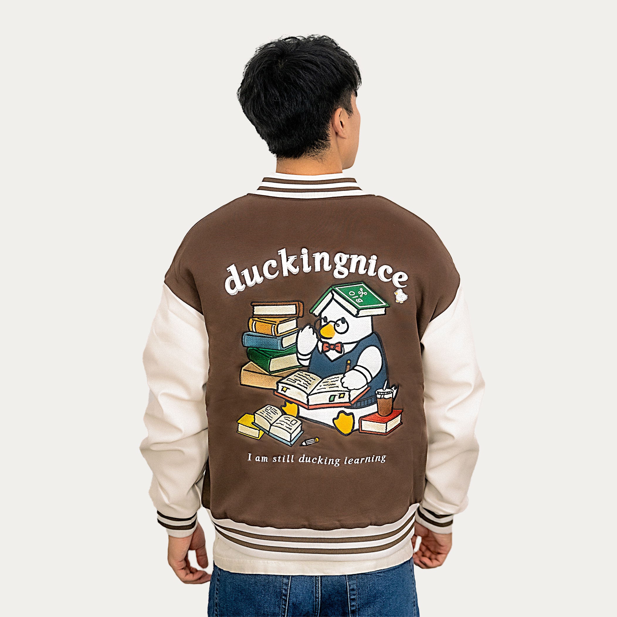 "STUDENT DUCK” VARSITY JACKET COFFEE